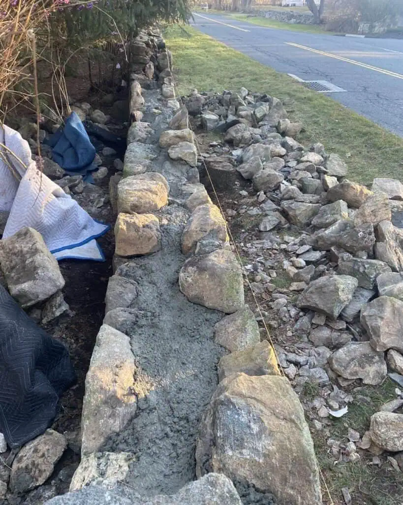 Rebuilding the stone fence.