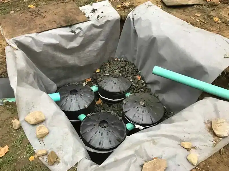 Drainage work installed in fall to prevent winter ice hazards on a Connecticut property